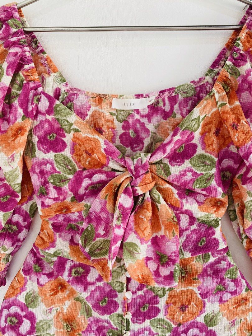 LUSH Floral Tie Front Romper (Category: Rompers) located in Vigan. Submitted by yourcloset1001 (Listing ID 1463912728, Image 2). Description: - Brand: LUSH - Style: Floral Romper - Features: Tie front detail, square neckline, puff sleeves with elastic cuffs - Closure: Button front - Occasion: Perfect for day outs, casual events, and summer wear.