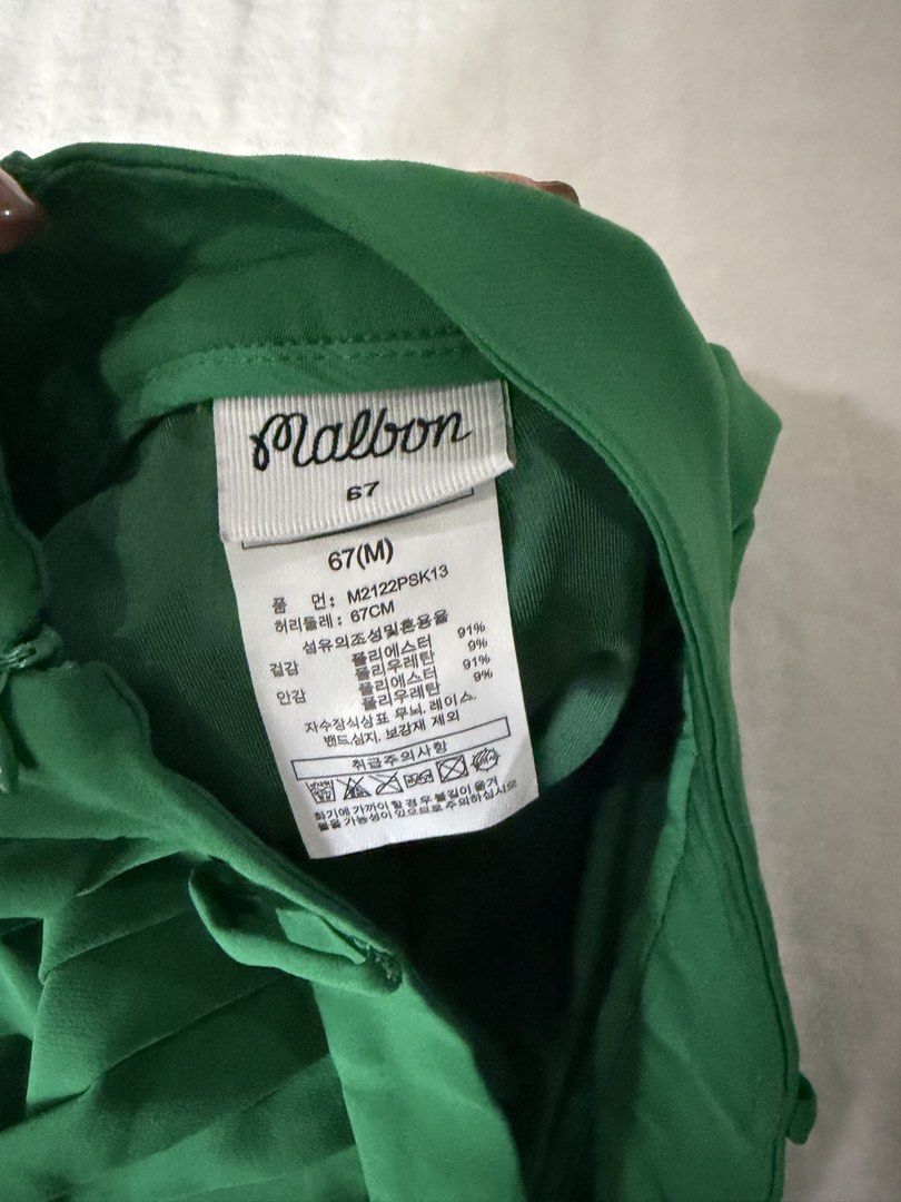 Malbon Green Pleated Golf/Pickleball Skort (Category: Skirts) located in Cebu City. Submitted by thestylemd (Listing ID 1463811389, Image 3). Description: - Brand: Malbon - Style: Pleated Skirt - Color: Green - Size: 67 (Medium) - Features: White stripes at the hem - Perfect for: Golf/pickleball - with inner shorts .