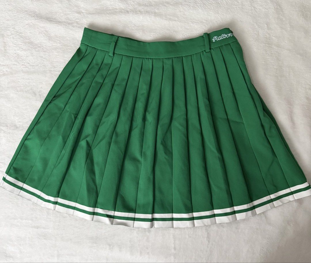 Malbon Green Pleated Golf/Pickleball Skort (Category: Skirts) located in Cebu City. Submitted by thestylemd (Listing ID 1463811389, Image 1). Description: - Brand: Malbon - Style: Pleated Skirt - Color: Green - Size: 67 (Medium) - Features: White stripes at the hem - Perfect for: Golf/pickleball - with inner shorts .