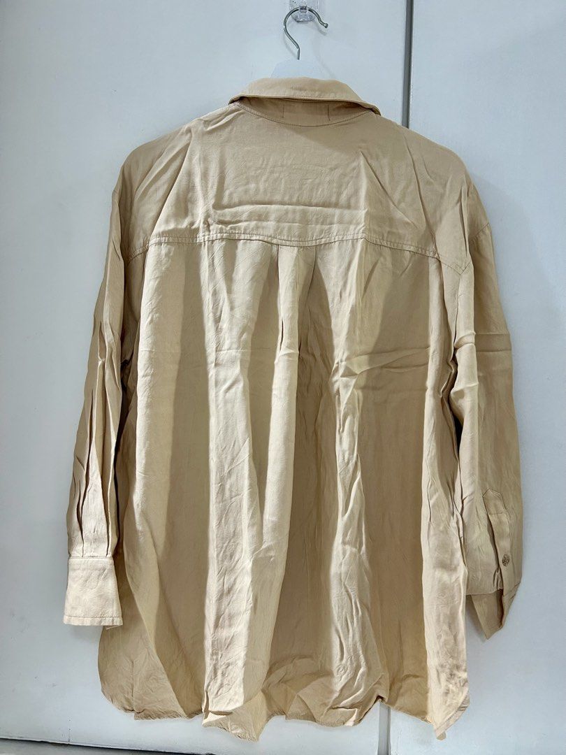 MANGO Beige Oversized Button-Up Shirt (Category: Shirts) located in Manila. Submitted by isabelle_1104 (Listing ID 1463889205, Image 3). Description: Used only once. Good as new. Oversized. Can. Fit up to medium.
