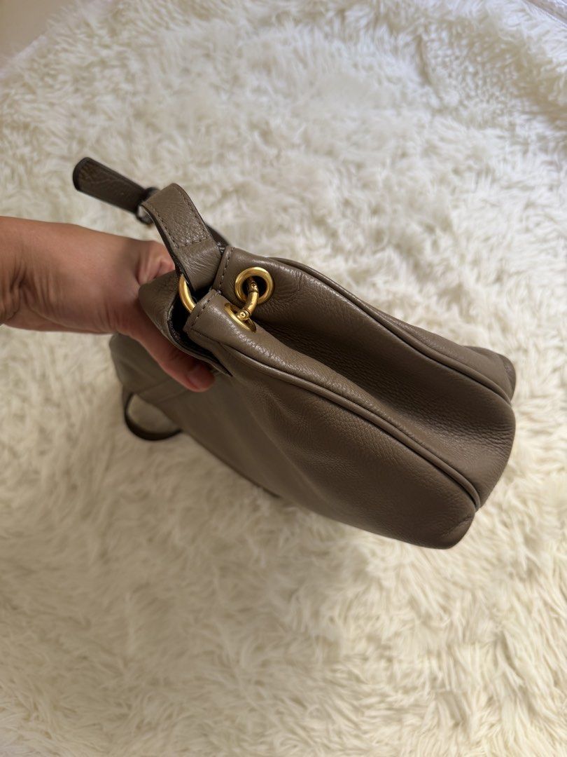 Marc by Marc Jacobs Grey Leather Shoulder Bag (Category: Luxury Bags & Wallets) located in Cebu City. Submitted by gdcebu (Listing ID 1463923821, Image 2). Description: - auth Marc by Marc Jacobs shoulder bag - Soft, grey pebbled leather - Elegant gold hardware details - Spacious main compartment - Interior zip pocket for essentials - Adjustable strap for comfortable wear - Ideal everyday bag.