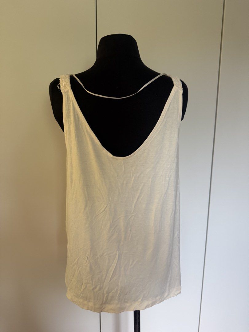 Marks & Spencer Ivory Sequin V-Neck Cami Top Size 14 (Category: Sleeveless) located in Manila. Submitted by cristycrab247 (Listing ID 1463813962, Image 2). Description: - Sparkly ivory cami top - Brand: Marks & Spencer - Neckline: V-neck front, plain back - Embellishment: Covered in sequins - Occasion: Perfect for parties or dressing up an outfit - Size: 14.