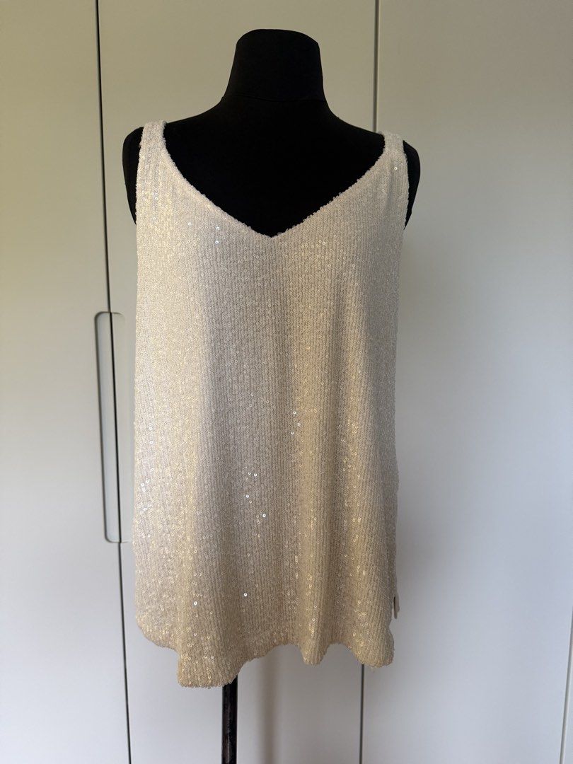 Marks & Spencer Ivory Sequin V-Neck Cami Top Size 14 (Category: Sleeveless) located in Manila. Submitted by cristycrab247 (Listing ID 1463813962, Image 1). Description: - Sparkly ivory cami top - Brand: Marks & Spencer - Neckline: V-neck front, plain back - Embellishment: Covered in sequins - Occasion: Perfect for parties or dressing up an outfit - Size: 14.