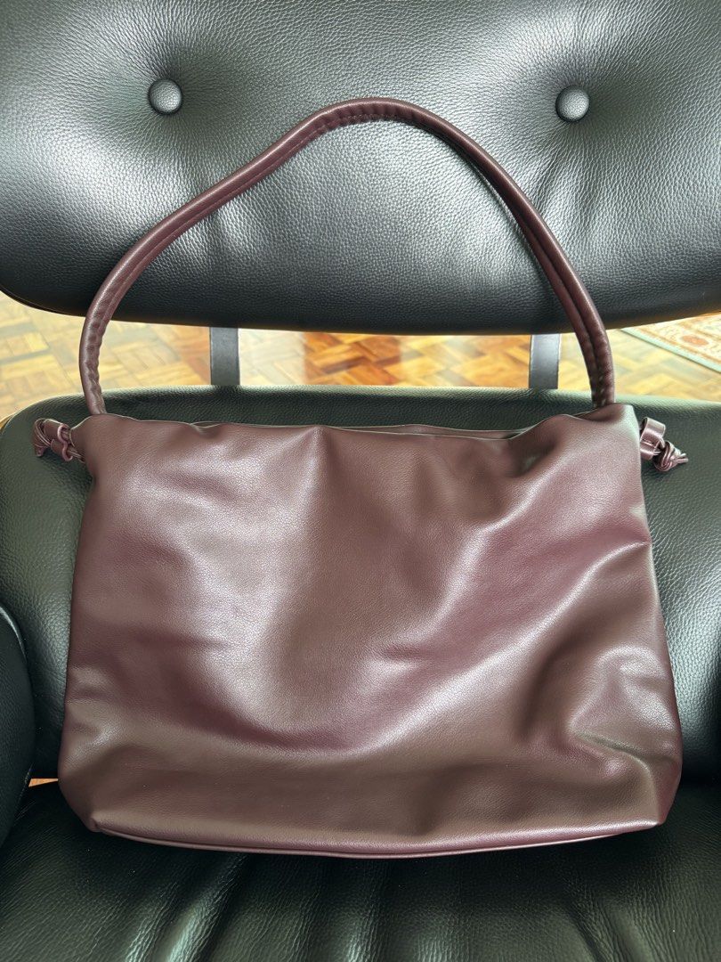 Maroon soft leather drawstring bag (Category: Shoulder Bags) located in Pasig City. Submitted by calumpagpatrise (Listing ID 1463785118, Image 3). Description: - Brand & Product Name: Mumu Select - Danica - Bought from TT Shop - Like new; Used only once—during my trip to Seoul - With Dust Bag - Can fit a lot - Has 2 compartments inside: 1 with zipper, 1 leather - Price is negotiable!! - RFS: I don’t use it anymore.