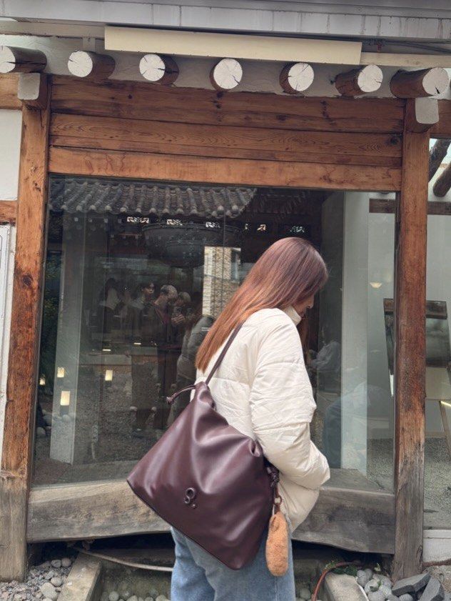 Maroon soft leather drawstring bag (Category: Shoulder Bags) located in Pasig City. Submitted by calumpagpatrise (Listing ID 1463785118, Image 1). Description: - Brand & Product Name: Mumu Select - Danica - Bought from TT Shop - Like new; Used only once—during my trip to Seoul - With Dust Bag - Can fit a lot - Has 2 compartments inside: 1 with zipper, 1 leather - Price is negotiable!! - RFS: I don’t use it anymore.