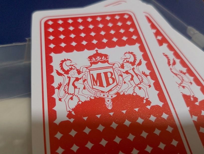 MB Playing Cards with Case (Category: Board Games & Puzzles) located in Quezon City. Submitted by susmaryosep1 (Listing ID 1463853134, Image 3). Description: - MB playing cards - Comes in a clear plastic case - Features a unique Joker design - MB crest on card backs - Ideal for games or collecting 300.