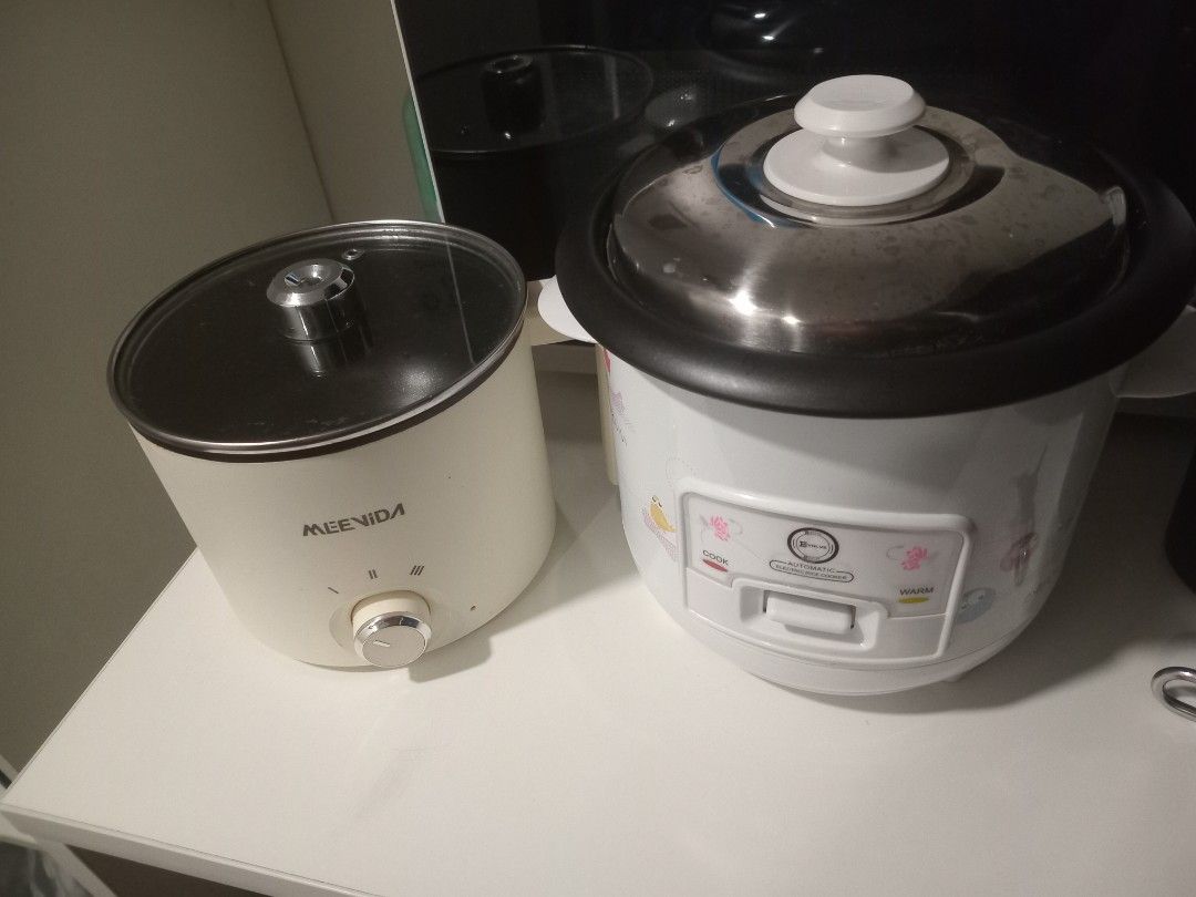 MEENIDA Rice Cooker & Automatic Electric Rice Cooker (Category: Cookers) located in Manila. Submitted by rexatat (Listing ID 1463804438, Image 1). Description: - MEENIDA Rice Cooker: Features a convenient glass lid and easy-to-use dial control. - Automatic Electric Rice Cooker: White, with essential cook and warm functions for hassle-free rice preparation. - Both are reliable kitchen appliances for perfectly cooked rice..