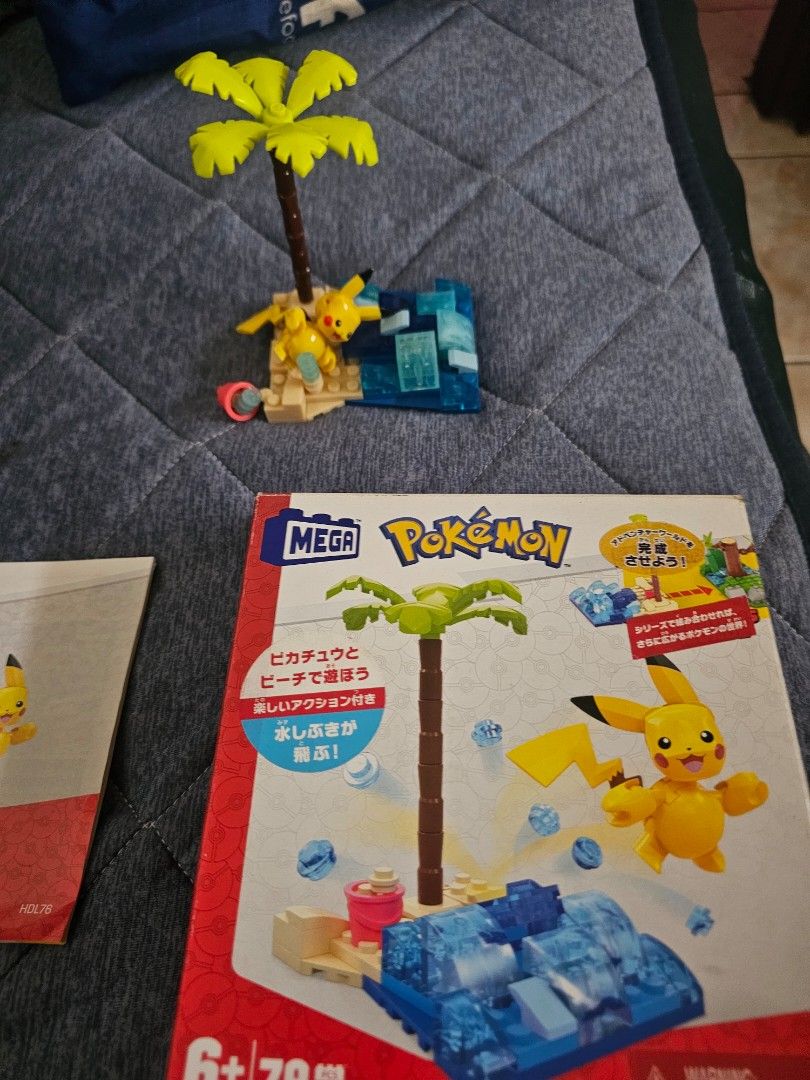 Mega Construx Pokemon Pikachu's Beach Splash Building Set HDL76 (Category: Lego & Building Sets) located in Muntinlupa City. Submitted by jojiepogi123 (Listing ID 1463769158, Image 1). Description: - Mega Construx Pokemon Building Set - Features Pikachu on a beach with palm tree and water - Includes building blocks and a Pikachu figure - Box displays a larger scene with other Pokemon characters (not included) - Instructions included - Perfect for