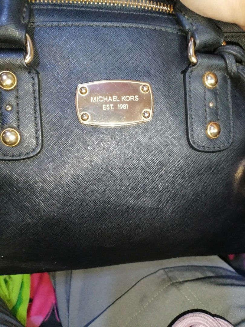 Michael Kors Black Leather Satchel Handbag (Category: Luxury Bags & Wallets) located in Digos. Submitted by crodualady82694 (Listing ID 1463757315, Image 3). Description: - Authentic Michael Kors black leather satchel bag - Elegant gold hardware details - Signature Michael Kors logo lining inside - Secure zipper closure - Ideal for daily use.