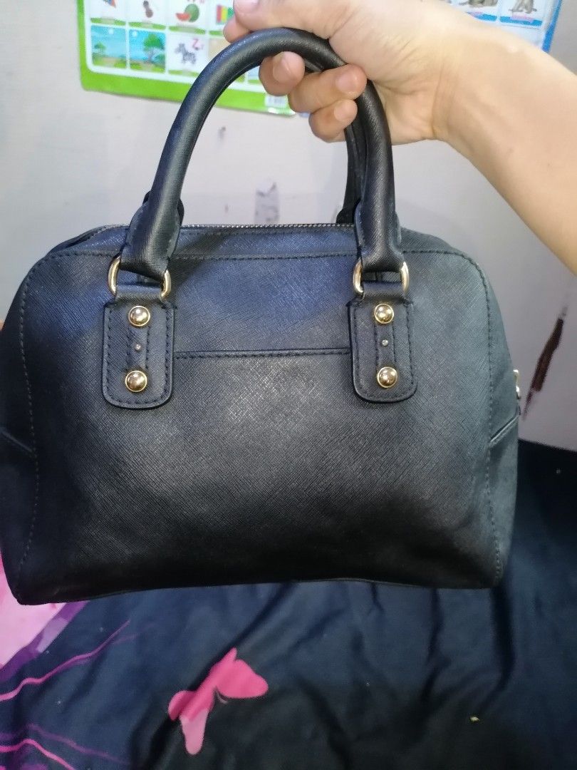 Michael Kors Black Leather Satchel Handbag (Category: Luxury Bags & Wallets) located in Digos. Submitted by crodualady82694 (Listing ID 1463757315, Image 2). Description: - Authentic Michael Kors black leather satchel bag - Elegant gold hardware details - Signature Michael Kors logo lining inside - Secure zipper closure - Ideal for daily use.
