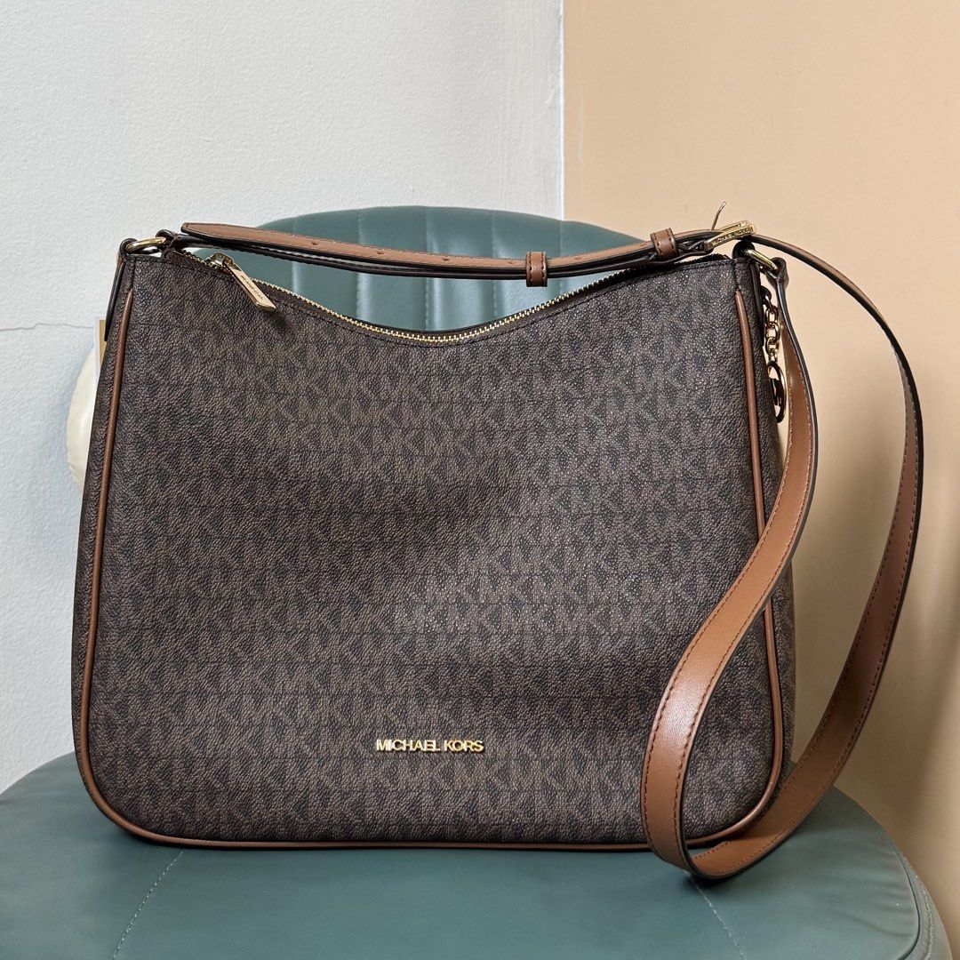 Michael Kors Brown Leather Shoulder Bag (Category: Luxury Bags & Wallets) located in Las Pinas. Submitted by odezz (Listing ID 1463760203, Image 1). Description: - brand new - Authentic/original Michael Kors bag comes with orig paper bag - bought in US - 2 design MK monogram print and another one is brown - Adjustable shoulder strap.
