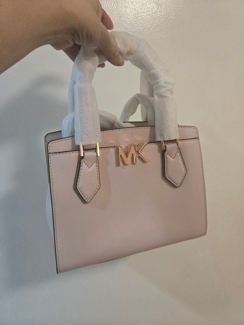 Michael Kors Pink Leather Top Handle Bag (Category: Luxury Bags & Wallets) located in Manila. Submitted by weylinta (Listing ID 1463854027, Image 1). Description: - Authentic Michael Kors handbag - Lovely light pink color - Gold MK logo hardware - Handles still have protective plastic wrap - Ideal for everyday or special occasions - Comes with original dust bag.