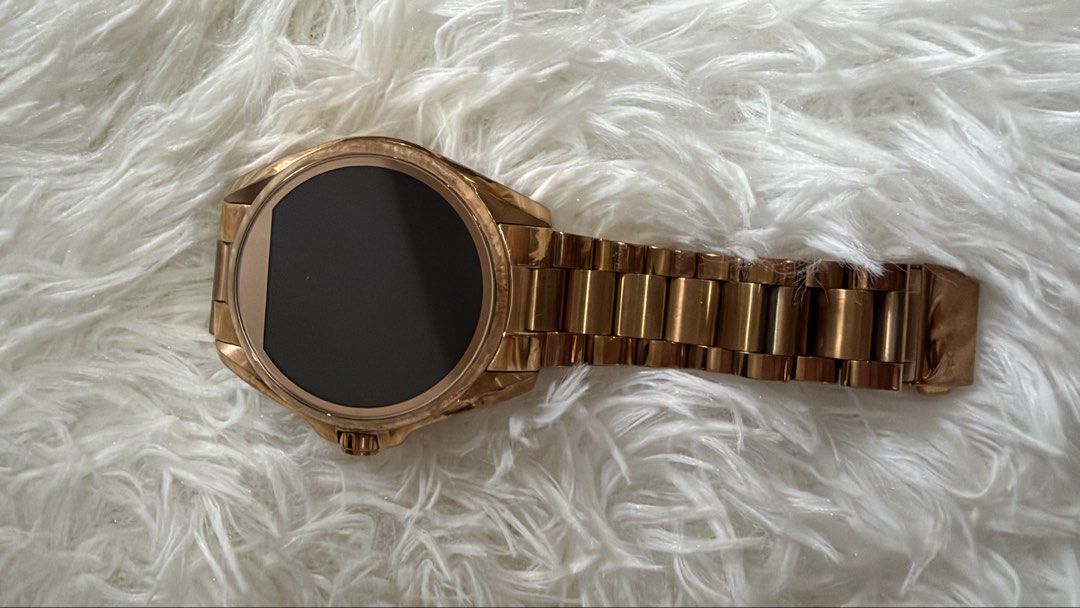 Michael Kors Rose Gold Smartwatch (Category: Women's Watches) located in Dumaguete. Submitted by freshcornerbyyeng (Listing ID 1463787088, Image 1). Description: - Rose gold Michael Kors smartwatch - Metal link strap - Digital display - Crown on the side - Minor scuffs on clasp and casing from normal wear - Still looks great - Selling as is -no box no inclusion -watch only.