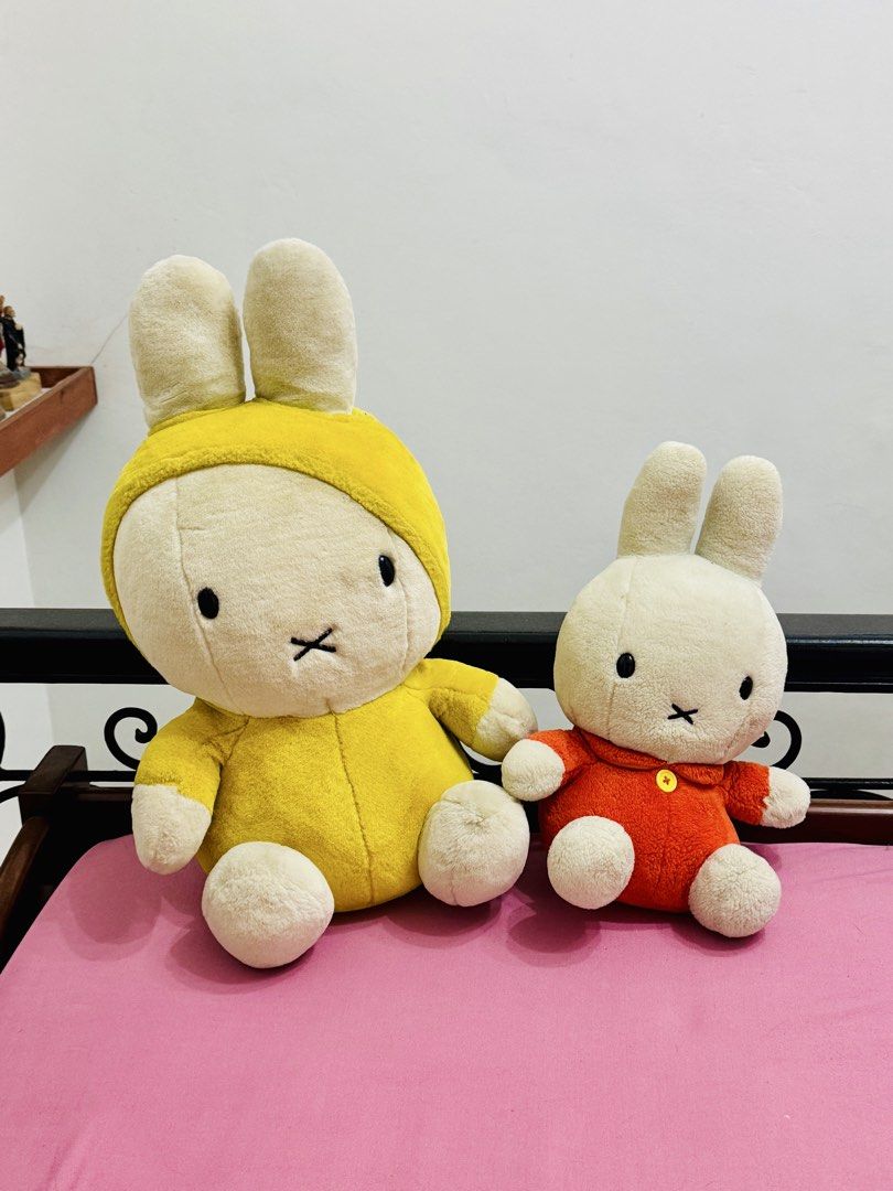 Miffy Plush Toys (Category: Plushies & Soft Toys) located in Muntinlupa City. Submitted by readthedetails (Listing ID 1463820571, Image 1). Description: - Two Miffy plush toys available. - One Miffy wears a cute yellow hooded outfit. - The other Miffy is dressed in an orange outfit with a button detail. - Both plush toys are soft and cuddly. - Ideal for Miffy collectors and fans. - Also perfect as a charming decoration. - Both Miffy plush toys ar