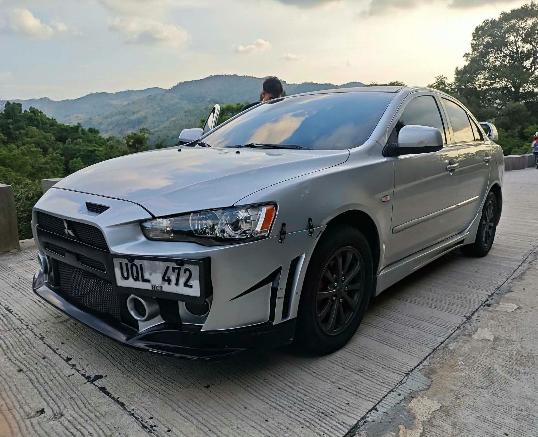 Mitsubishi Lancer 1.6 EX (A) (Category: Used Cars) located in Quezon City. Submitted by dgzkie (Listing ID 1463807221, Image 2). Description: For Sale: 2013 Mitsubishi Lancer EX 1.6 A/T Mileage: 84,000 kms All stock (Internals, Lights, Mags, Etc.) Monday Coding Upgrades: -FQ400 Bodykits by P4 Paints & Bodykits -Sideplate -Full Exhaust & Air Intake by CRL Performance Original K&N Air Intake Filter -Street Tuned / Remapped by CRL Performance -Pops 