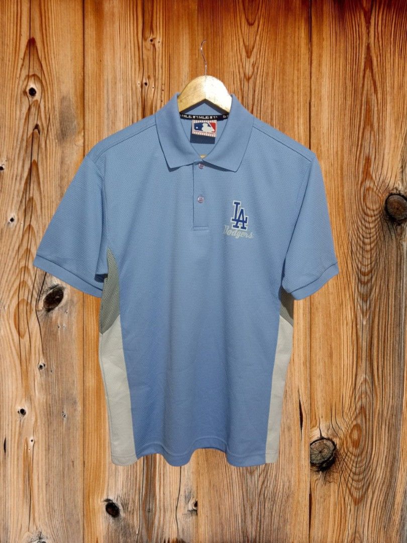 MLB LA Dodgers Polo shirt (Category: Tshirts & Polo Shirts ) located in Davao. Submitted by ayeeasyshop13 (Listing ID 1463893926, Image 1). Description: This is a powder blue Los Angeles Dodgers polo shirt featuring the print team logo on the chest. As new condition Size medium on tag Dimension 21/28 500 + SF.