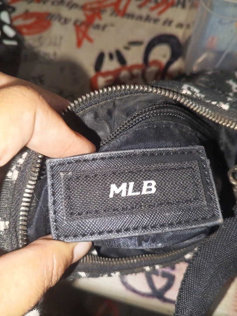 MLB New York Yankees Monogram Shoulder Bag (Category: Shoulder Bags) located in Magalang. Submitted by zeiansoria64090 (Listing ID 1463751891, Image 3). Description: - Stylish black and white monogram shoulder bag - Features prominent New York Yankees logo - Secure zippered closure - Convenient inner pocket - MLB logo tag inside - Ideal for everyday wear or showcasing team spirit.