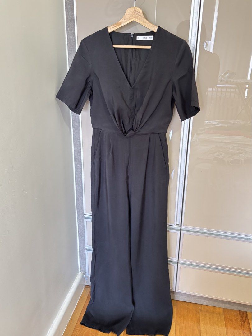 Mango Black Jumpsuit (Category: Jumpsuits) located in Pasay City. Submitted by mommapauie (Listing ID 1463897973, Image 2). Description: - Mango black jumpsuit - Features a stylish knot detail at the front - Flattering wide leg silhouette - Convenient side pockets - Short sleeves for comfort - Versatile for dressing up .