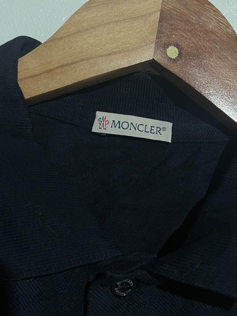 Moncler Authentic Navy Polo Shirt (Category: Tshirts & Polo Shirts ) located in Maasin. Submitted by trippythirftyyy (Listing ID 1463878846, Image 3). Description: - Classic Navy Blue Moncler polo shirt -Size small -width:19 -Length:24 - Features iconic three-circle logo on chest - Made in Turkey - Button closure at the neck - Versatile for casual or smart-casual wear -Complete tags .