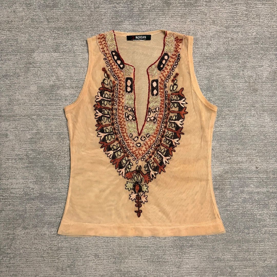 Morgan de toi peach-colored mesh (Category: Sleeveless) located in Calamba. Submitted by bermuda.ph (Listing ID 1463883557, Image 1). Description: Featuring a deep Vneckline adorned with intricate colorful embroidery and small metallic bead accents .