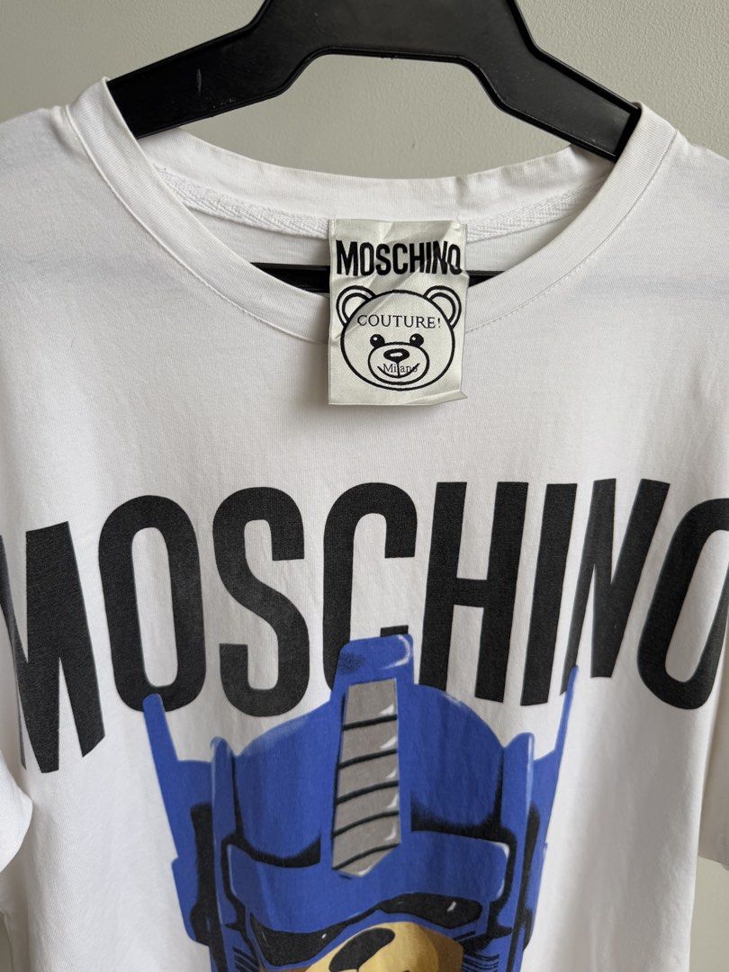 Moschino (Category: Tshirts & Polo Shirts ) located in Angeles City. Submitted by afterwear.thrift (Listing ID 1463815164, Image 3). Description: Moschino W21” x L28” Branded. Curated item that is good as new..