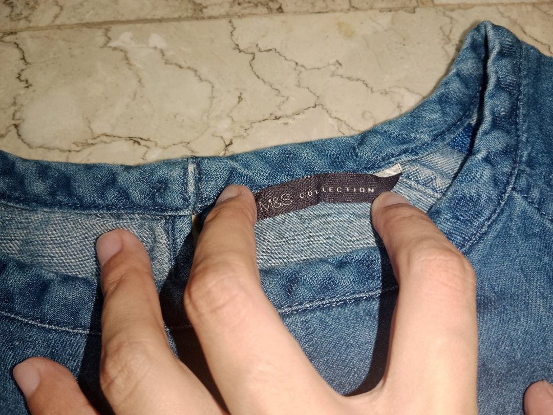 M&S Collection Blue Denim Top (Category: Blouses) located in Manila. Submitted by yethquiday (Listing ID 1463838822, Image 2). Description: - M&S Collection blue denim top - Short sleeves - Round neckline - Back button closure - Simple and classic design - Easy to pair with jeans or skirts - Great for casual wear.