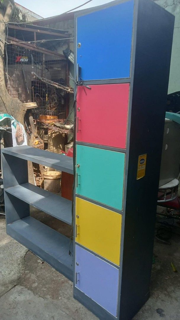Multi-colored 5-Tier Locker Cabinet with Lock (Category: Shelves, Cabinets & Racks) located in Quezon City. Submitted by madelrivera (Listing ID 1463827580, Image 3). Description: - 5-tier locker cabinet - Each door has a lock and key - Available colors: blue, red, teal, yellow, purple - Ideal for organizing and storage.