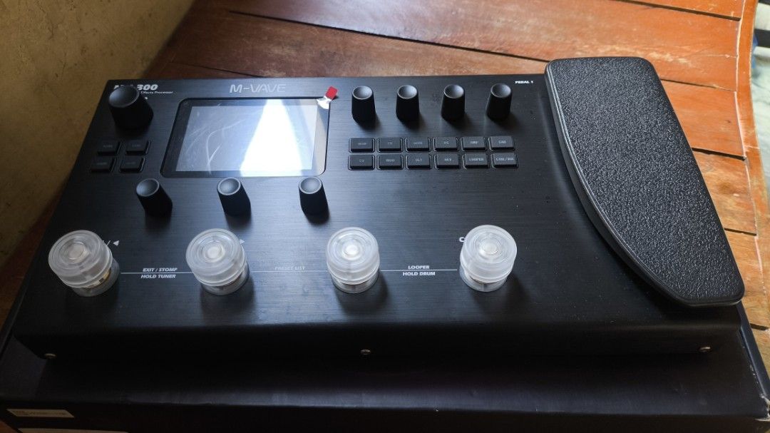 M-Wave MK-300 Amp Modeler/Effects Processor Guitar Pedal (Category: Musical Instruments) located in Taguig. Submitted by chesuteru (Listing ID 1463744823, Image 3). Description: - M-Wave MK-300 Guitar Amp Modeler & Effects Processor - Built-in Expression Pedal - Looper Function Included - Numerous Presets for Diverse Tones - Extensive Sound-Shaping Controls - Comes in Original Packaging with Foam Inserts - Ideal for Guitarists Seeking Versatility