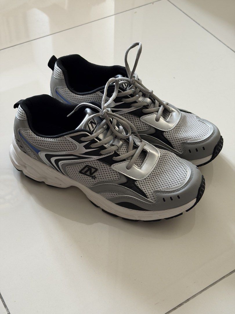 Natasha Running Shoes Grey Silver (Category: Sneakers) located in Taguig. Submitted by liapol2710 (Listing ID 1463786639, Image 1). Description: - Brand: Natasha - Color: Grey and Silver - Size: 10 - Material: Breathable mesh upper - Features: Padded collar and tongue for comfort, durable rubber outsole - Ideal for: Running, workouts, or casual wear.