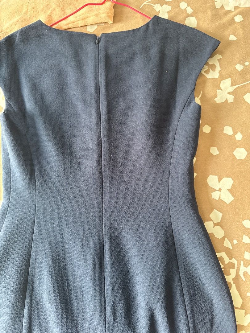 Navy Blue Cap Sleeve Flared Hem Dress (Category: Dresses) located in Makati City. Submitted by eskarina62 (Listing ID 1463813508, Image 3). Description: - Navy blue dress - Cap sleeves - Subtle textured fabric - Slightly flared hem - Back zipper closure - Ideal for work or smart casual occasions - Professional and chic look.