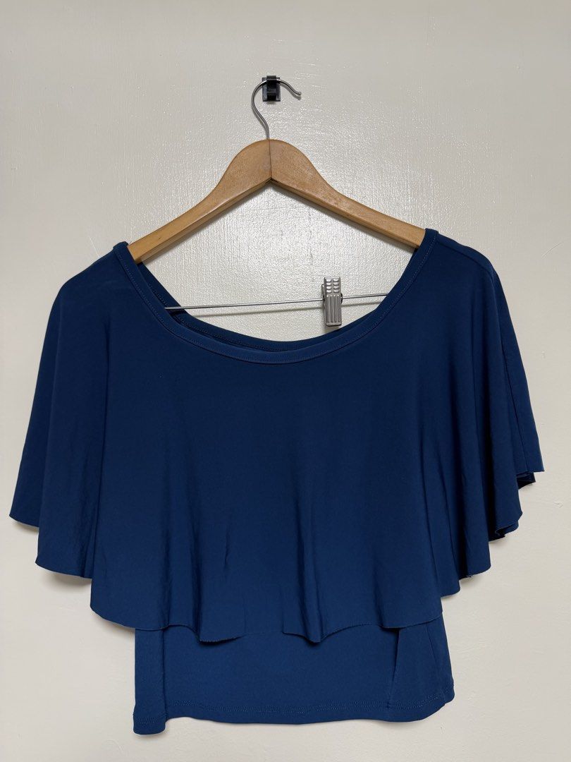 Navy Blue Layered Flutter Sleeve Top (Category: Sleeveless) located in Manila. Submitted by don_p (Listing ID 1463868023, Image 2). Description: M to L - Navy blue top - Layered flutter sleeves - Scoop neckline - Relaxed fit - Comfortable and versatile - Perfect for casual outings or layering.