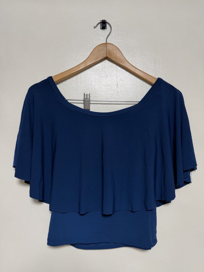 Navy Blue Layered Flutter Sleeve Top (Category: Sleeveless) located in Manila. Submitted by don_p (Listing ID 1463868023, Image 1). Description: M to L - Navy blue top - Layered flutter sleeves - Scoop neckline - Relaxed fit - Comfortable and versatile - Perfect for casual outings or layering.