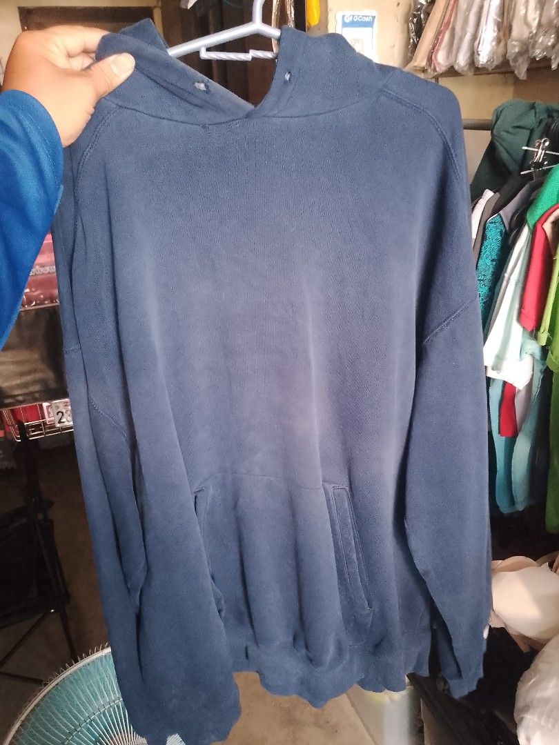 Navy Blue Russell Athletic Hoodie (Category: Coats, Jackets and Outerwear) located in Manila. Submitted by romeoamoro00044 (Listing ID 1463804502, Image 3). Description: - Classic navy blue hoodie from Russell Athletic - Long sleeves with ribbed cuffs - Front kangaroo pocket - Hood with adjustable drawstring - Perfect for casual everyday wear - Shows some signs of wear, but still in good usable condition.