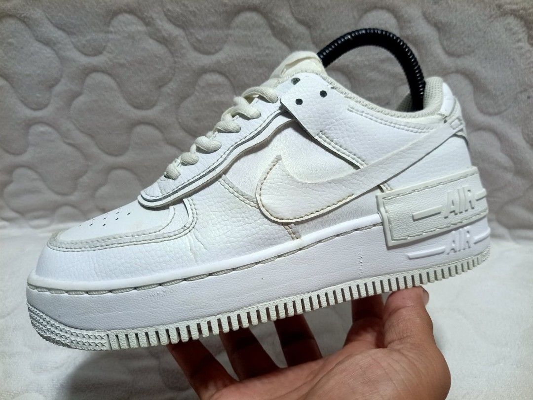Nike Air Force 1 Shadow White Sneakers (Category: Sneakers) located in Manila. Submitted by urbantreasures.101 (Listing ID 1463788197, Image 1). Description: - White Nike Air Force 1 Shadow sneakers - Classic design with a modern layered sole - Secure lace-up closure - Perfect for everyday casual wear - Shows some signs of wear (soles and toe box) - Still has plenty of wear left.
