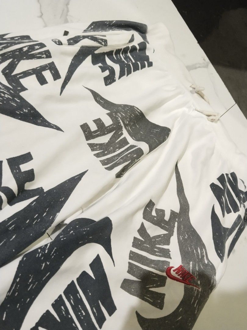Nike AOP swoosh (Category: Shorts) located in Iloilo. Submitted by raydelcanomay (Listing ID 1463784688, Image 2). Description: NIKE AOP SHORT Size - 2XL Dimes - W30 TO 46 LEG OPENING 11 Colorate - 9.4 Condition - GOOD Tags - COMPLETE Issue - GRAPHIC FADE, 1 PINHOLE AND LINTS Price - 250.