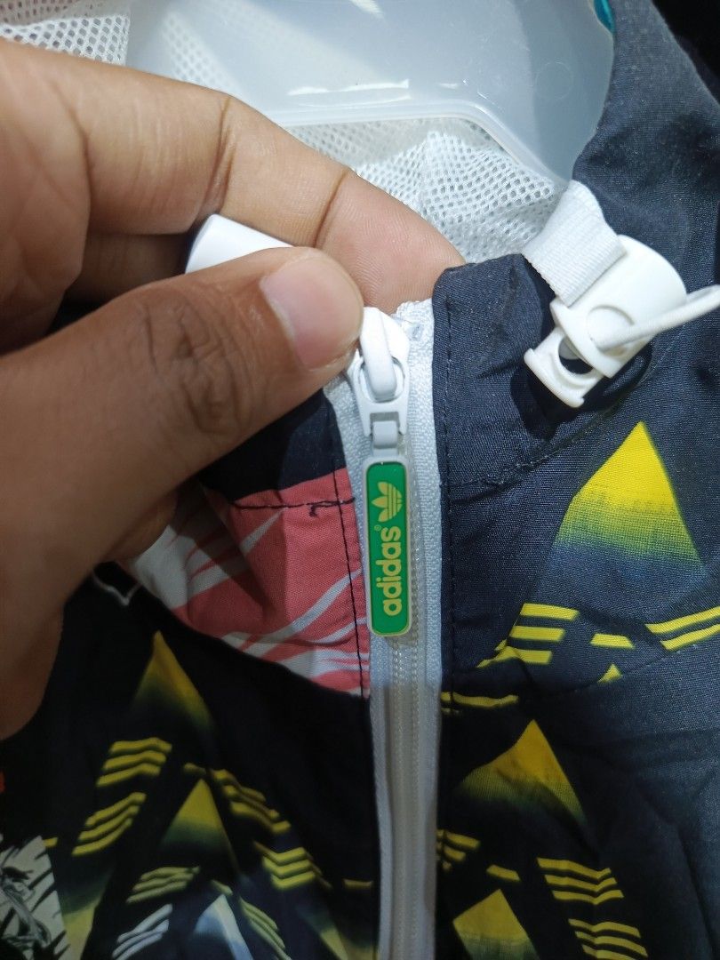 Wind Breaker Nike AP0708 DUFTN01HED CL5 Jacket (Category: Coats, Jackets and Outerwear) located in Cabatuan. Submitted by penthegreat (Listing ID 1463860686, Image 2). Description: Size L on tag good fit L-XL - Stylish Nike jacket with a unique abstract print. - Comfortable mesh lining for breathability. - Durable YKK zipper for smooth operation. - Model Number: AP0708 DUFTN01HED CL5 - Made in China. - Ideal for everyday casual wear or athletic a
