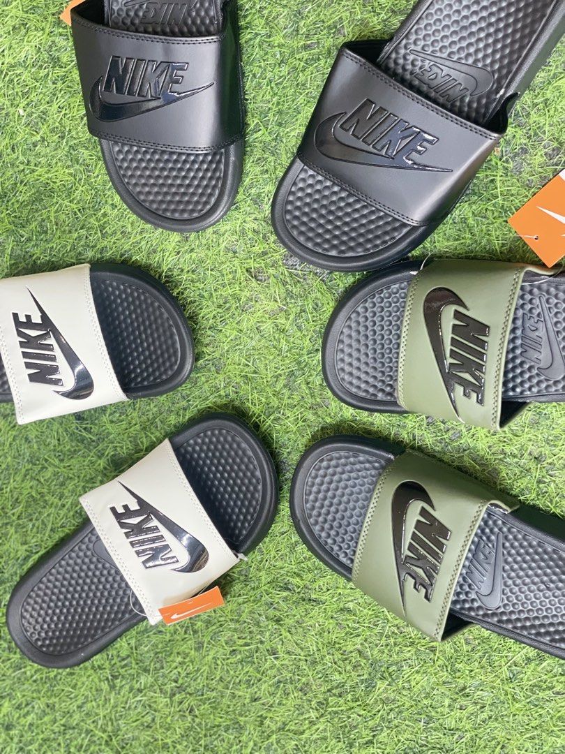 Nike Benassi JDI Slides - Multiple Colors Available (Category: Slippers & Slides) located in Manila. Submitted by alaineramos (Listing ID 1463784477, Image 1). Description: - Classic Nike Benassi Slides - Available Colors: Black, White with Black Swoosh, Olive Green with Black Swoosh - Comfortable and durable for everyday wear - Perfect for the pool or casual outings.