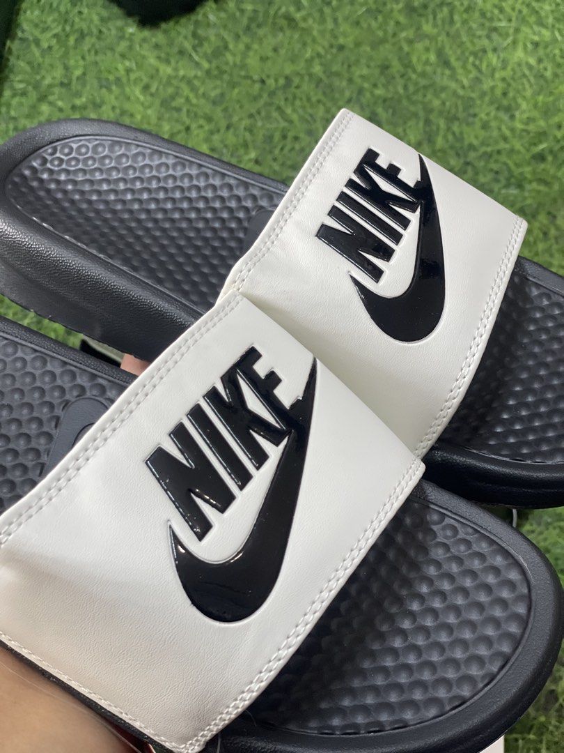 Nike Benassi JDI Slides - Multiple Colors Available (Category: Slippers & Slides) located in Manila. Submitted by alaineramos (Listing ID 1463784477, Image 2). Description: - Classic Nike Benassi Slides - Available Colors: Black, White with Black Swoosh, Olive Green with Black Swoosh - Comfortable and durable for everyday wear - Perfect for the pool or casual outings.