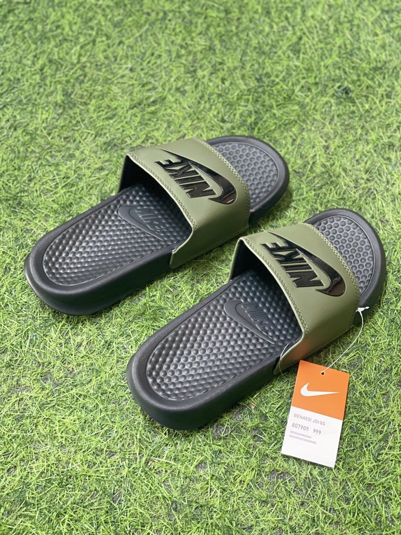 Nike Benassi JDI Slides - Multiple Colors Available (Category: Slippers & Slides) located in Manila. Submitted by alaineramos (Listing ID 1463784477, Image 3). Description: - Classic Nike Benassi Slides - Available Colors: Black, White with Black Swoosh, Olive Green with Black Swoosh - Comfortable and durable for everyday wear - Perfect for the pool or casual outings.