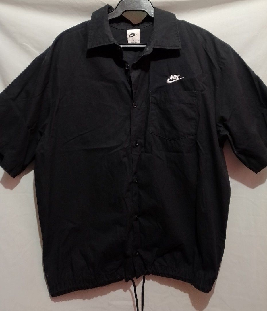 Nike Black Short Sleeve Button Up Shirt (Category: Shirts) located in Manila. Submitted by nievesolanna (Listing ID 1463932030, Image 1). Description: preloved. no issues. used once only. original nike. original price: 2,895 pesos selling price: 1,500 pesos rfs: too many clothes. nakatambak na lang LOC: SAMPALOC, MANILA.