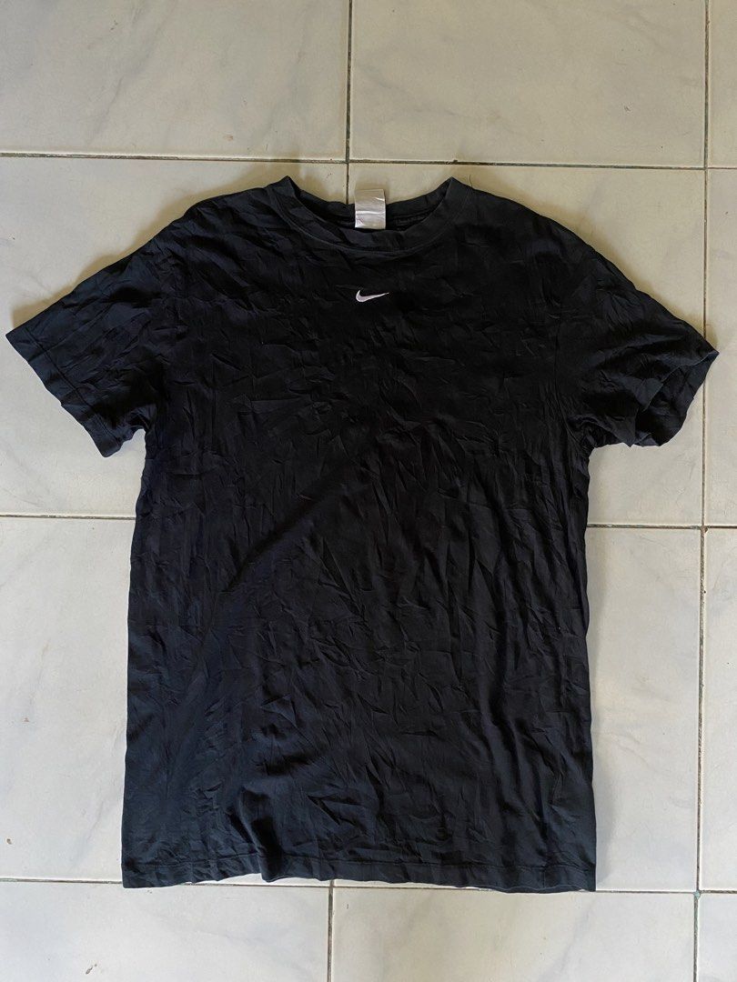 Nike Black T-Shirt Size L (Category: Tshirts & Polo Shirts ) located in Iloilo. Submitted by laughthrift_goods (Listing ID 1463839749, Image 1). Description: - Classic black Nike t-shirt - Features a small white Nike swoosh logo on the chest - Made from comfortable 100% cotton - Size: Large (L) - Ideal for casual and everyday outfits Excellent Condition Large on tag dimes:20.5Width 30Length No issue .