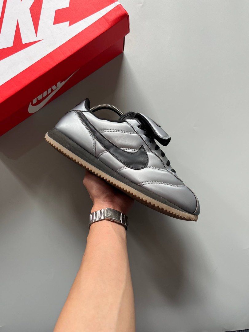 NIKE CORTEZ SE TIEMPO PACK (10.5US) (Category: Sneakers) located in Baguio. Submitted by grabUrPairs (Listing ID 1463833921, Image 1). Description: - Authentic Nike Cortez '72 sneakers - Striking metallic silver and black colorway - Iconic Cortez silhouette - Convenient velcro strap closure - '72' detail prominently displayed on the heel - Comes with the original Nike box.