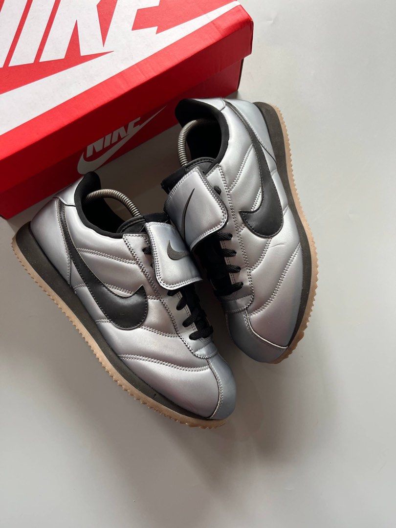 NIKE CORTEZ SE TIEMPO PACK (10.5US) (Category: Sneakers) located in Baguio. Submitted by grabUrPairs (Listing ID 1463833921, Image 3). Description: - Authentic Nike Cortez '72 sneakers - Striking metallic silver and black colorway - Iconic Cortez silhouette - Convenient velcro strap closure - '72' detail prominently displayed on the heel - Comes with the original Nike box.