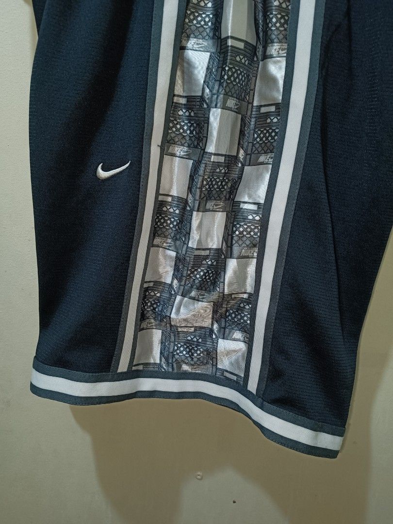 Nike DNA Short (Category: Shorts) located in Makati City. Submitted by ivsseyow03 (Listing ID 1463748497, Image 2). Description: Selling these Nike Dri-FIT basketball shorts. Size M, navy blue with a cool checkered panel down the sides. Has a drawstring waist and a zippered pocket. Great for sports or casual wear. Made in Vietnam..