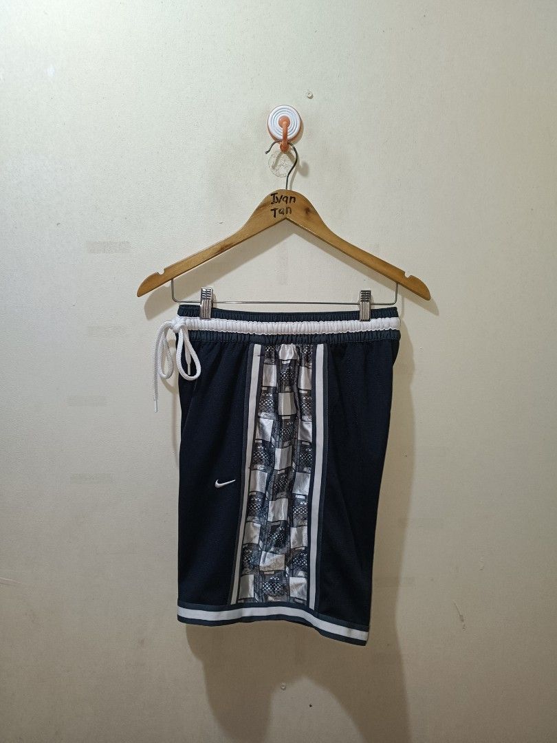 Nike DNA Short (Category: Shorts) located in Makati City. Submitted by ivsseyow03 (Listing ID 1463748497, Image 1). Description: Selling these Nike Dri-FIT basketball shorts. Size M, navy blue with a cool checkered panel down the sides. Has a drawstring waist and a zippered pocket. Great for sports or casual wear. Made in Vietnam..