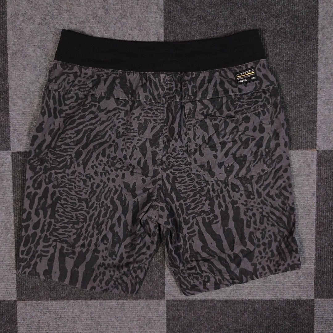 Nike F.C. Shorts Size M - Grey Camo Pattern (Category: Shorts) located in Tagum. Submitted by kitlowisthrift (Listing ID 1463871719, Image 2). Description: - Nike F.C. shorts - Size: Medium (M) - Color: Cool grey and black camouflage print - Features: Pockets, side zip pocket - Waistband: Elastic for comfort - Ideal for: Casual wear or sports activities - Origin: Made in China.