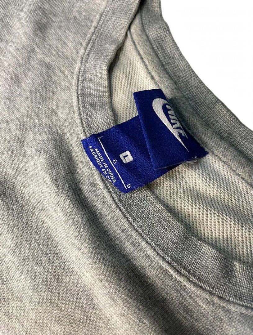 Nike Grey Crewneck Sweatshirt Size L (Category: Coats, Jackets and Outerwear) located in Santa Maria. Submitted by lftgcollective (Listing ID 1463910972, Image 3). Description: - Grey Nike sweatshirt - Size L - Small embroidered swoosh on chest - Crewneck, long sleeves - Cotton and polyester blend - Ideal for casual wear.