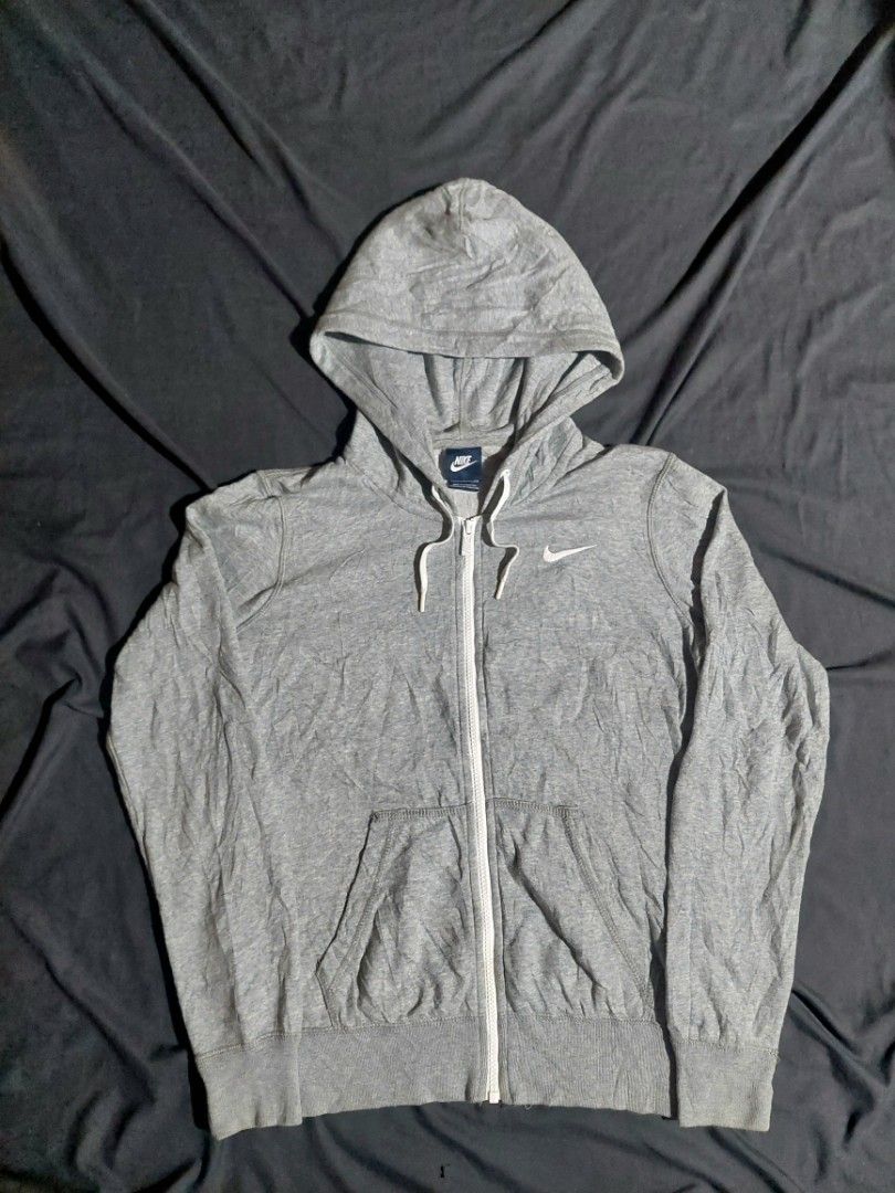 Nike Grey Zip-Up Hoodie (Category: Hoodies) located in Manila. Submitted by ashibambum_05 (Listing ID 1463929828, Image 1). Description: - Grey Nike zip-up hoodie -Size small-medium - Classic Nike swoosh logo on chest - Drawstring hood for adjustable comfort - Convenient front pockets - Made in Indonesia - Ideal for everyday casual wear.