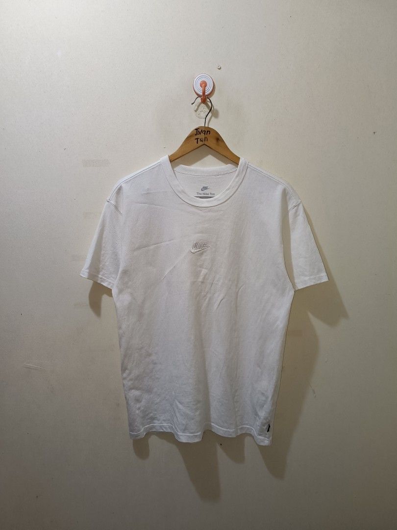 Nike Mid Swoosh Shirt (Category: Tshirts & Polo Shirts ) located in Makati City. Submitted by ivsseyow03 (Listing ID 1463748445, Image 1). Description: White Nike t-shirt. Features a small embroidered Nike logo on the chest. The Nike Tee label is visible on the neckline. Made from comfortable fabric. Great for casual wear..
