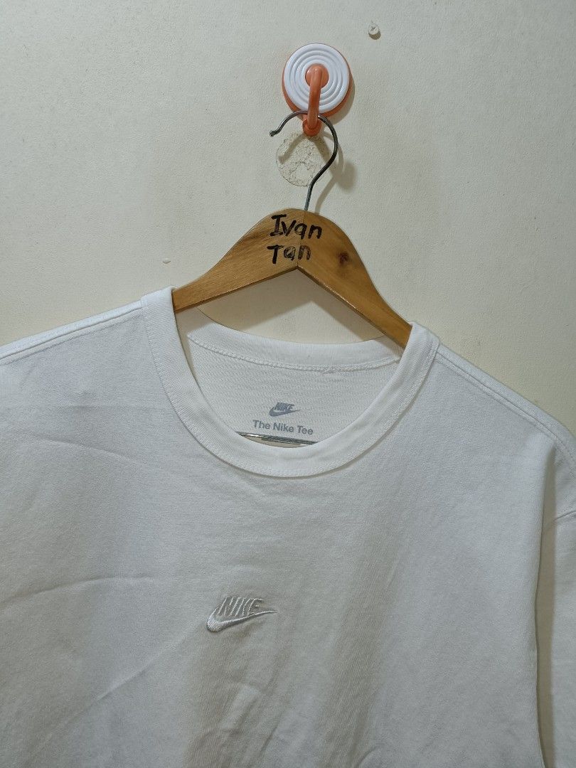 Nike Mid Swoosh Shirt (Category: Tshirts & Polo Shirts ) located in Makati City. Submitted by ivsseyow03 (Listing ID 1463748445, Image 2). Description: White Nike t-shirt. Features a small embroidered Nike logo on the chest. The Nike Tee label is visible on the neckline. Made from comfortable fabric. Great for casual wear..